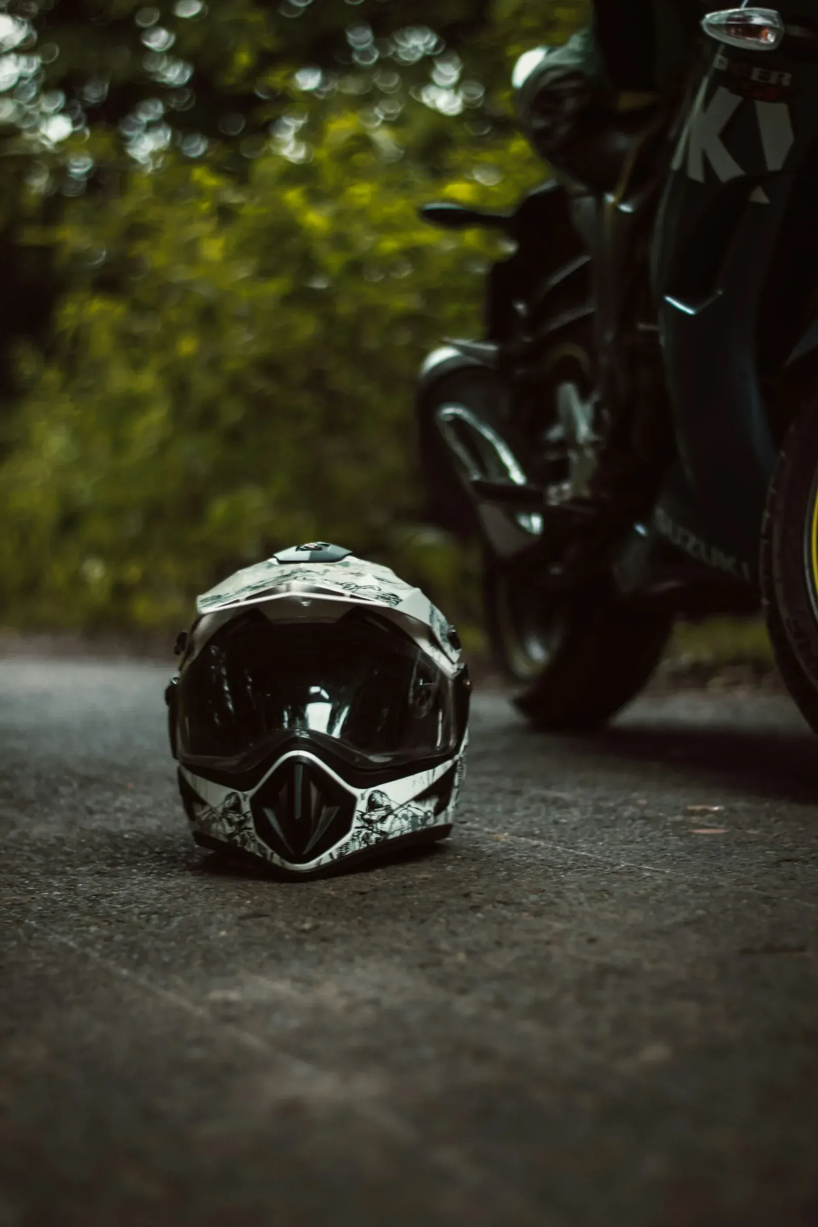 Helmet beside a motorcycle; photo by Tushar Ranjan Seth on Unsplash.